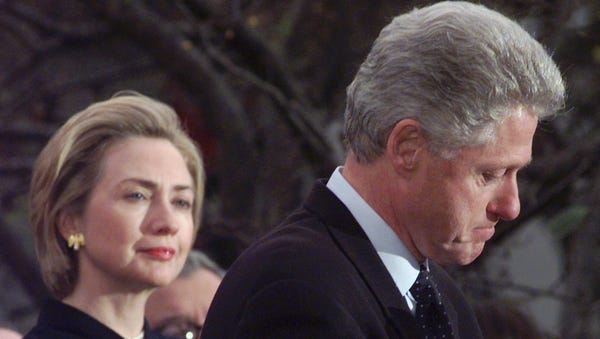 First lady Hillary Clinton looks on as President B