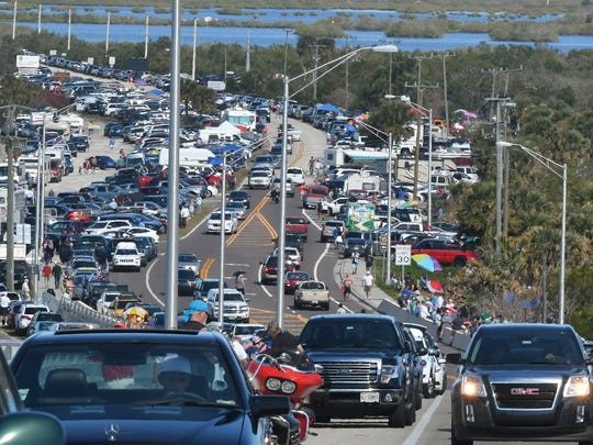 Spectators gathered near the A. Max Brewer memorial bridge in Titusville for the launch of SpaceX Falcon Heavy on February 2, 2018.