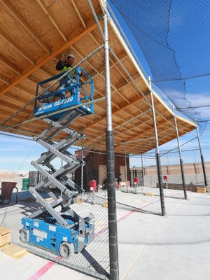 Ramon Valle worked on the construction at the Sportspark batting cages area Monday. 