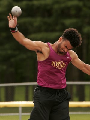 Licking Heights senior Jaylen Stokes throws the shot put May 12 during the Licking County League-Buckeye Division meet. Stokes earlier won the discus.