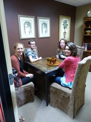 (From left to right) Shelby Reynolds, Tad Mast, Ashley Collins, and Lisa Conley on Wednesday, Oct. 12, inside the ‘Dinner Party’ room at Breakout Escape Room Bonita. This was minutes before the door was locked, and the team had 60 minutes to find a way out with the clues given. 