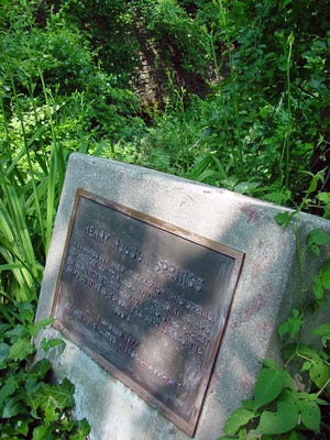 A plaque marking Henry Hudson Springs in Atlantic Highlands.