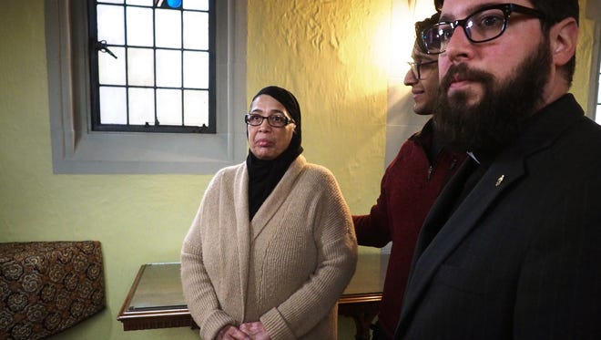 Rev. Nathan Dannison, right, senior minister at First Congregational Church of Kalamazoo speaks in support of Saheeda Nadeem, left, at First Congregational Church in downtown Kalamazoo, Mich., Monday, March 12, 2018. The church has offered sanctuary to Nadeem to avoid deportation.