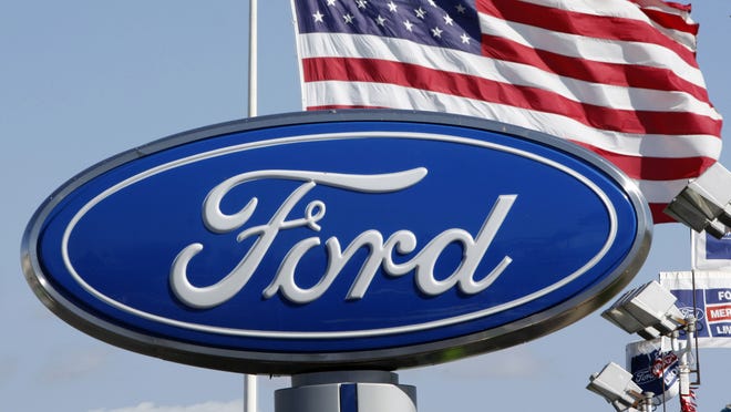 
 In this Oct. 25, 2010 photo, the Ford logo is displayed at a dealership in San Jose, Calif. 
