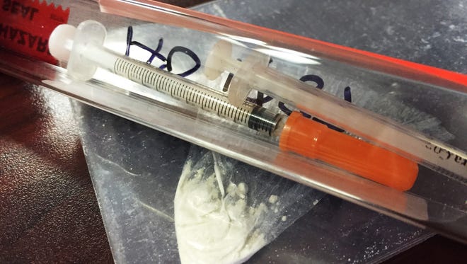 Needles and suspected recovered heroin seized by the Fremont Police Department.