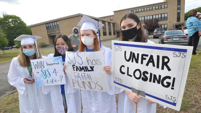 St. Jerome School grade 8 graduates, from left, Avery O'Neill-Kelleher, Mai Le, Maddie Hannan and Katie Clogston protest the Boston Archdiocese proposed closing of the North Weymouth school on Tuesday, June 2, 2020. Tom Gorman/For The Patriot Ledger