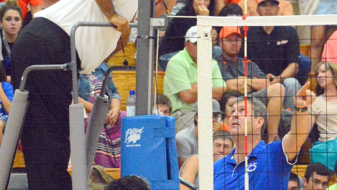 Bobby Bates pleads his case to have a Cavegirl point stand against Artesia on Tuesday, Sept. 29, 2015. Bates stepped down after two seasons as Carlsbad's volleyball coach.