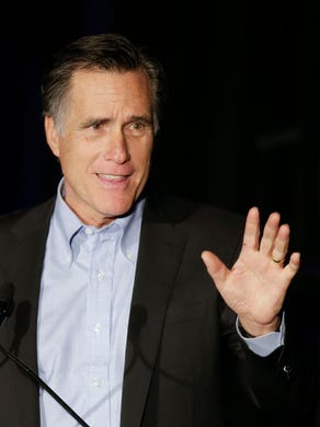 Mitt Romney addresses the Republican National Committee's winter meeting.