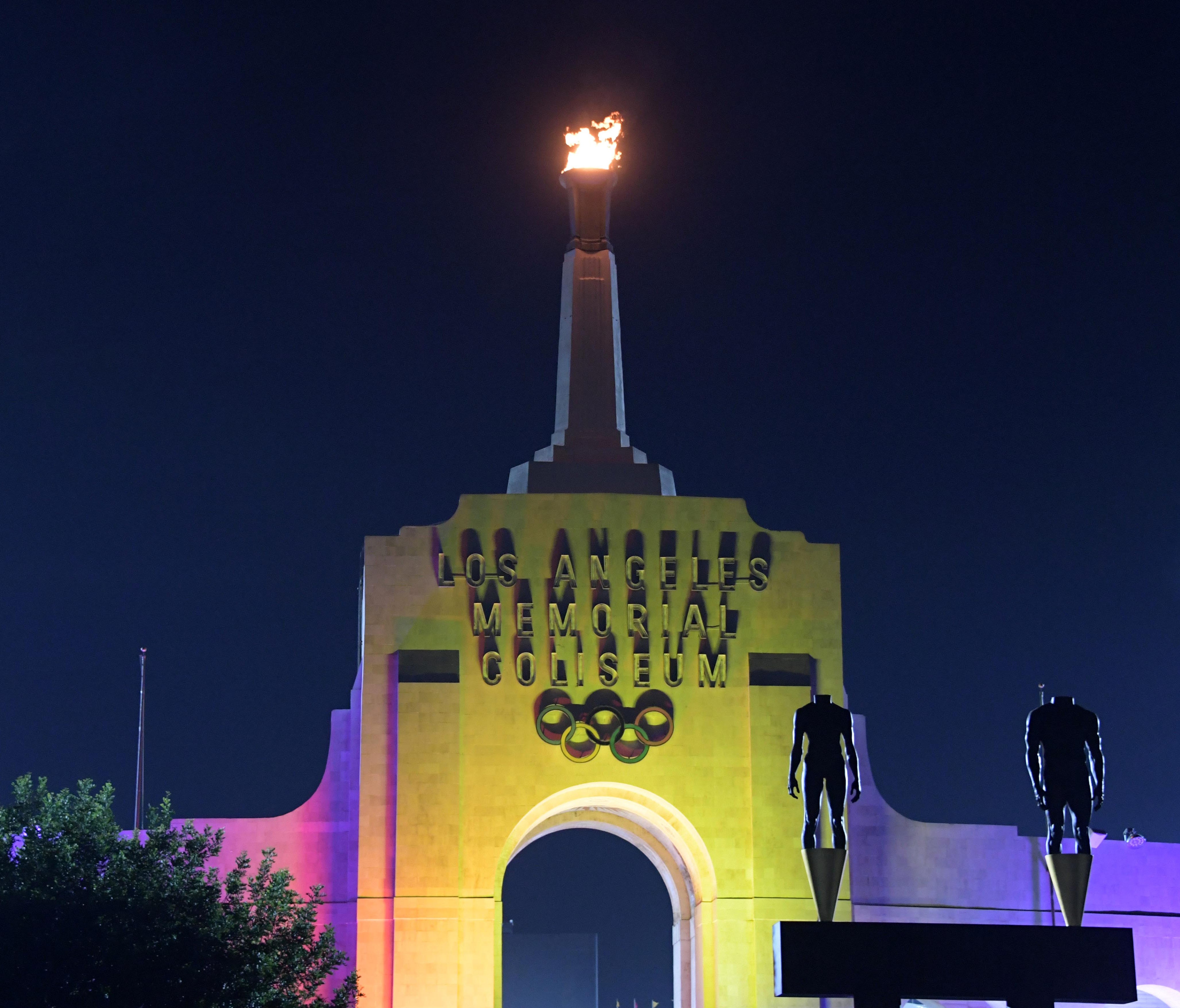 The Los Angeles Memorial Coliseum will be part of the 2028 Olympics. Here the torch is illuminated in the colors of the LA2028 logo to commemorate the awarding of the 2028 Olympics and Paralympics to Los Angeles on Sept. 12.