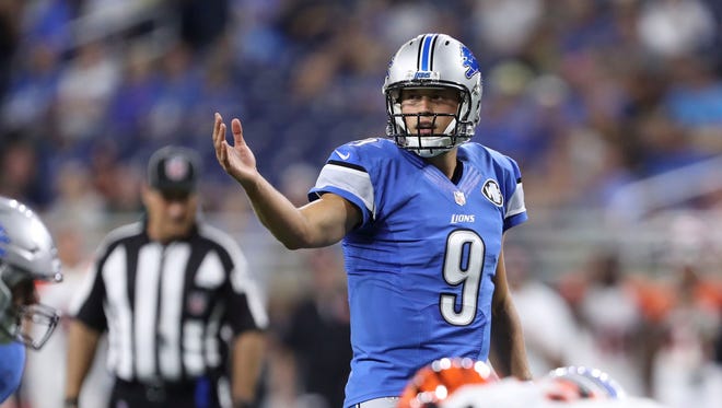 Aug 18, 2016; Detroit, MI, USA; Detroit Lions quarterback Matthew Stafford (9) makes adjustments before the snap against the Cincinnati Bengals during the first quarter at Ford Field.