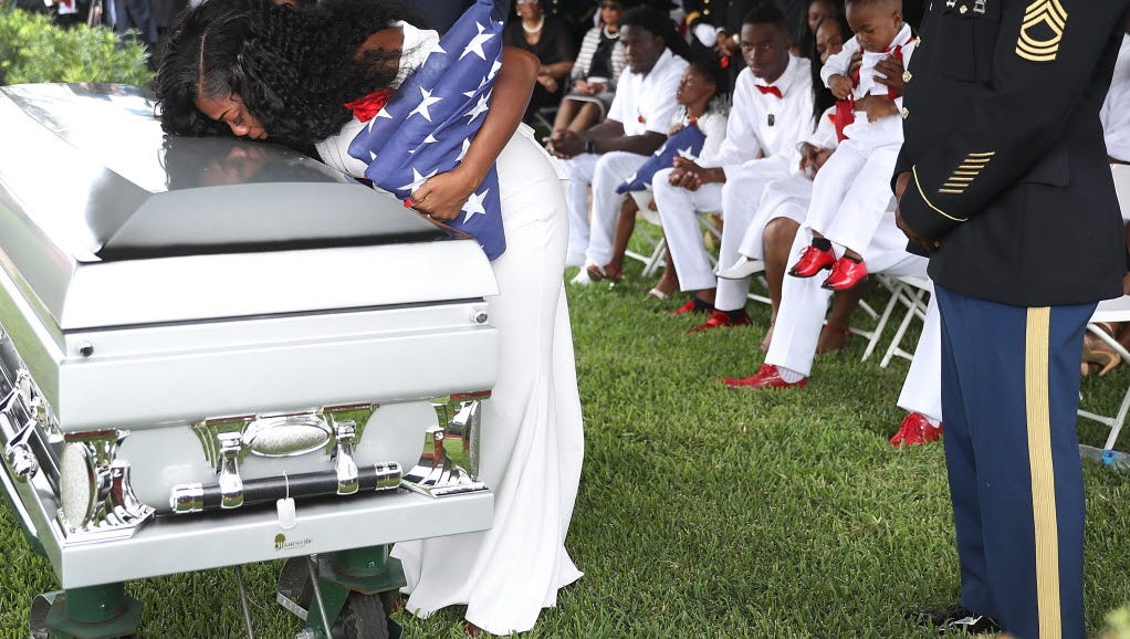 Myeshia Johnson kisses the casket of her husband,  Sgt. La David Johnson, in Hollywood, Fla., on Oct. 21, 2017.