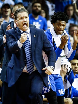 University of Kentucky head coach John Calipari (left) reacts during action against the University of North Carolina in their NCAA tournament Elite Eight matchup at the FedExForum. 