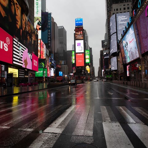 Times Square is mostly empty Monday in New York. G