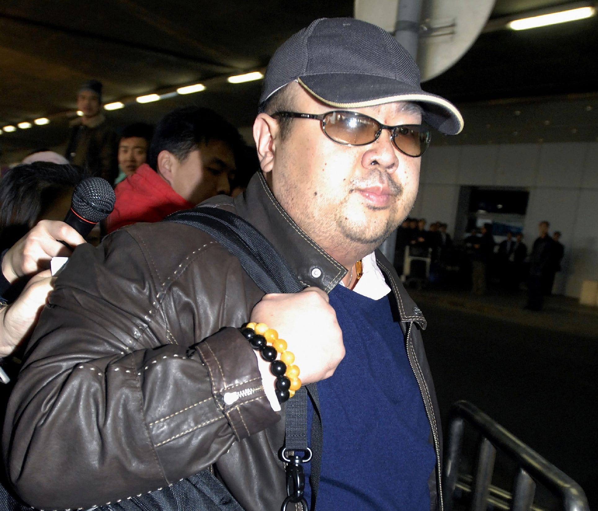 This file photo taken on February 11, 2007 shows a man believed to be then-North Korean leader Kim Jong Il's eldest son, Kim Jong Nam, walking amongs journalists upon his arrival at Beijing's international airport.
