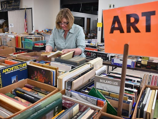 Ronda Hare sorts some of the 100,000 donated books