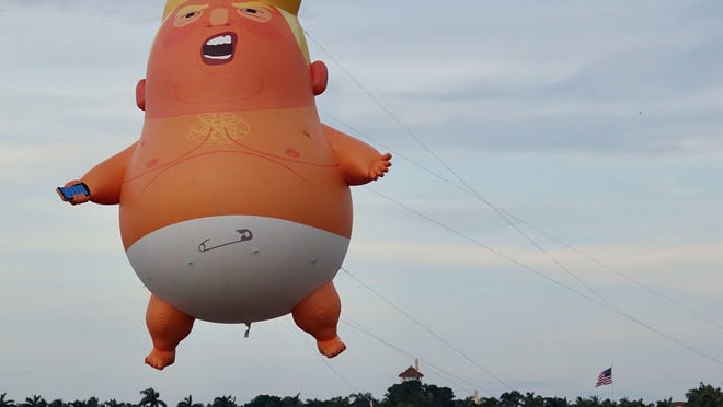 Protesters at the Declaration Juneteenth Solidarity event in West Palm Beach on Saturday, June 20, 2020, launched a "Baby Trump" balloon near the president's Mar-A-Lago estate just before sunset.