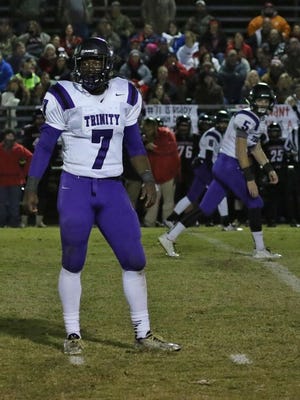 TCA's Andrew Goldsmith looks to the sideline for the play call Friday at Adamsville.