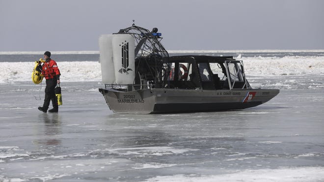 Emergency personnel prepare to rescue stranded fishermen off Catawba Island State Park, Ohio in Lake Erie, on Saturday, March 9, 2019.