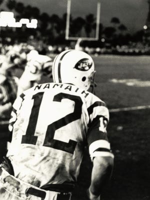 Jan 12, 1969; Miami, FL, USA; FILE PHOTO; New York Jets quarterback (12) Joe Namath takes the field after a victory against the Baltimore Colts in Super Bowl III at the Orange Bowl. Namath was the games most valuable player as the Jets defeated the Colts 16-7 to win the first ever Super Bowl title for the AFL. Mandatory Credit: Malcolm Emmons- USA TODAY Sports