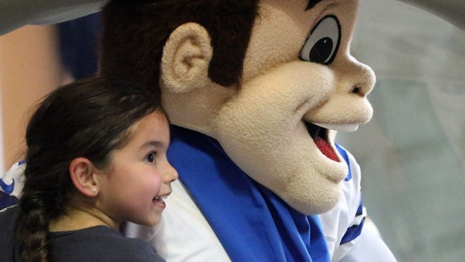 Elizabeth Prado, 5, gets her photo taken with Rowdy, the Dallas Cowboys official mascot, during an appearance at the Dallas Cowboys Pro Shop at The Outlet Shoppes at El Paso. A new shop will open later this year at Cielo Vista Mall.