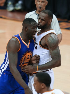 Draymond Green and LeBron James exchange words during the fourth quarter Friday night.