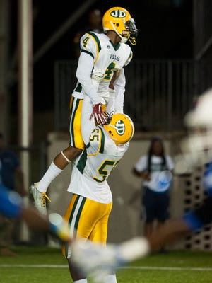 Jeff Davis' Zyon Gilbert (4) is lifted after scoring a touchdown against Lanier at Cramton Bowl in Montgomery, Ala., on Thursday September 22, 2016.