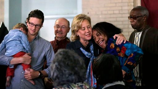 Sen. Mary Landrieu, D-La., hugs a polling volunteer as she arrives with her family to vote on election day in New Orleans Tuesday. At left is son Connor Snellings, holding grandson Maddox Snellings, and husband Frank Snellings, background.
