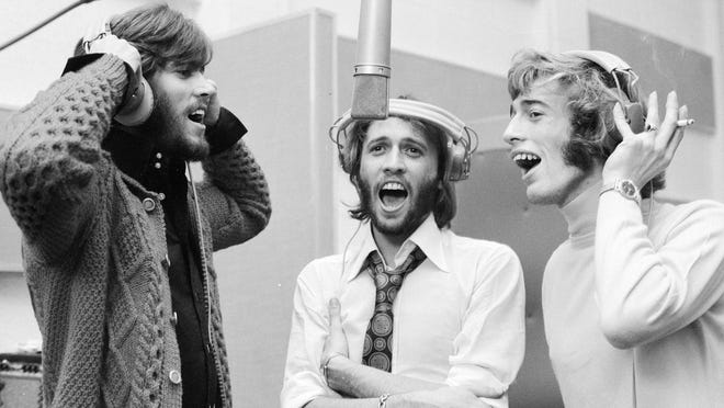 Barry, Maurice, and Robin Gibb reunite in the studio in 1970.