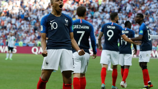 France's Kylian Mbappe celebrates after scoring his side's third goal during the round of 16 match between France and Argentina, at the 2018 soccer World Cup at the Kazan Arena in Kazan, Russia, Saturday, June 30, 2018. (AP Photo/David Vincent)