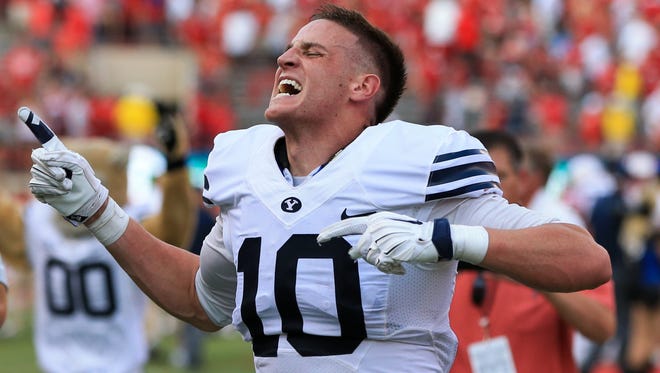 BYU wide receiver Mitch Mathews (10) reacts after catching the game-winning touchdown against Nebraska following the second half of an NCAA college football game in Lincoln, Neb., Saturday, Sept. 5, 2015. BYU won 33-28.