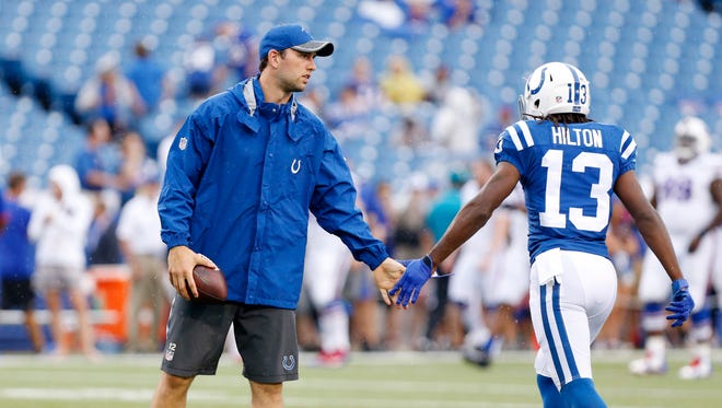 Colts quarterback Andrew Luck (12) and wide receiver T.Y. Hilton (13) tap hands before the game against the Buffalo Bills at Ralph Wilson Stadium.
