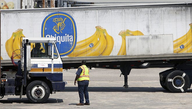 In this Aug. 28, 2008, photo, Chiquita trucks are evacuated out of the state port in Gulfport, Miss., in advance of Hurricane Gustav.