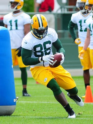 Green Bay Packers tight end Brandon Bostick runs through drills during minicamp practice at Ray Nitschke Field, Thursday, June 19, 2014.