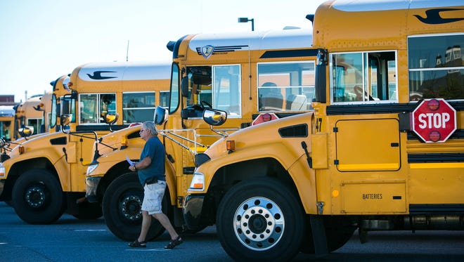 School buses line up outside an Appoquinimink School District building in this 2016 file photo.