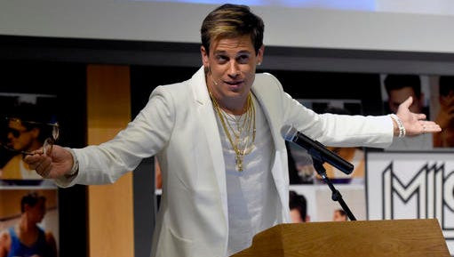 FILE - In this Jan. 25, 2017 file photo, Milo Yiannopoulos speaks on campus in the Mathematics building at the University of Colorado in Boulder, Colo. Sales are soaring for, "Dangerous," the upcoming book by the right-wing commentator. The book, scheduled to come out March 14. was in the top 10 on Amazon as of Thursday afternoon, a day after violent protests led the University of California, Berkeley to cancel his scheduled talk.
