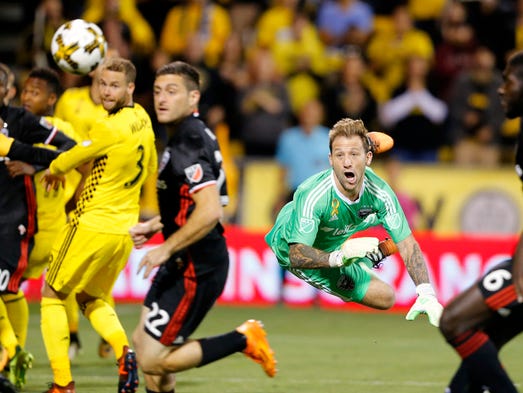 D.C. United goalkeeper Steve Clark makes a diving save