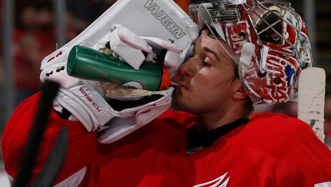 Red Wings goalie Petr Mrazek cools off during a time out in the first period against the Senators on Tuesday in Detroit.