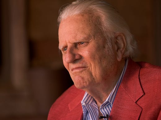 Billy Graham sits on the porch of his cabin May 12, 2005, in Montreat, N.C.