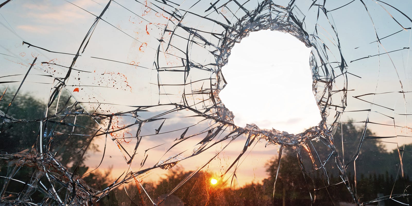 Teen throws rock through window