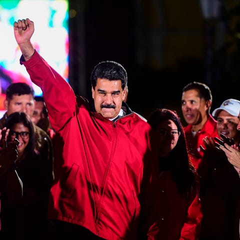 Venezuelan President Nicolas Maduro celebrates...