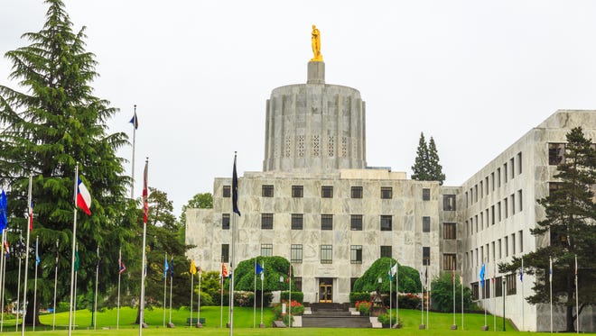 Getty Images/iStockphoto
The Oregon Capitol Building in Salem Oregon shows the pioneer statue atop the capitol.