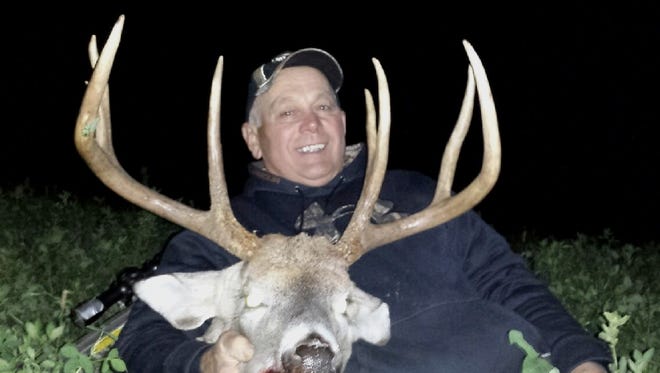 In only his second sit of the season, Ken Jeanquart used a crossbow to shoot this 220-pound buck nearly an hour before sunset Oct. 21, 2013 in northern Kewaunee County. The 8-pointer had a 21-inch inside spread. Jeanquart hunted near a scrape and some rubs adjacent to a clover plot.