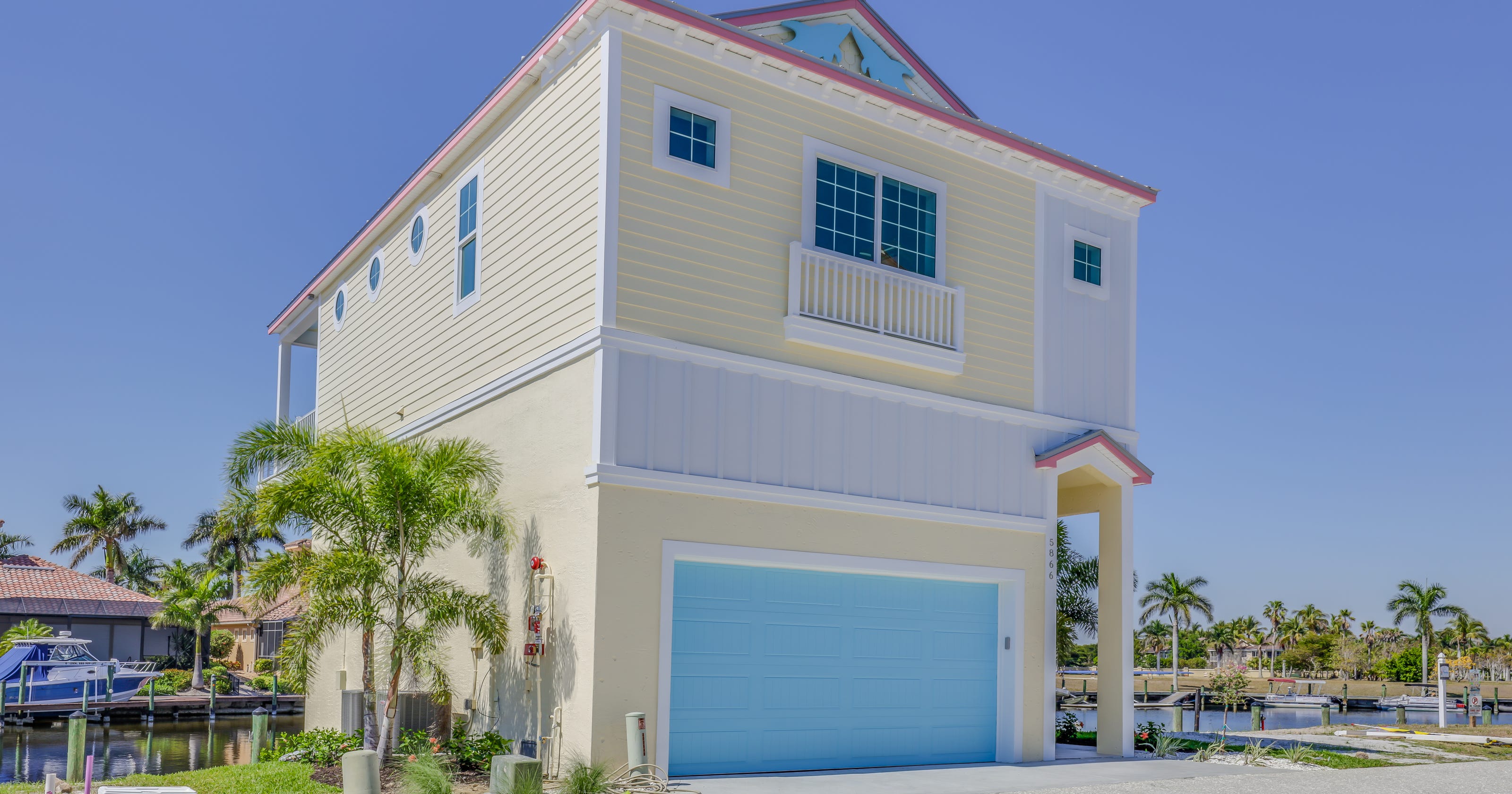 Whimsical Funky Fish Houses rising up on the waterfront in Cape Harbour