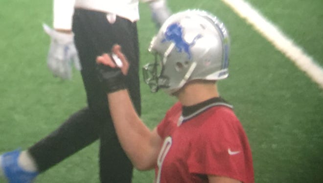 Detroit Lions quarterback Matthew Stafford practices with a glove Wednesday, Dec. 14, 2016.