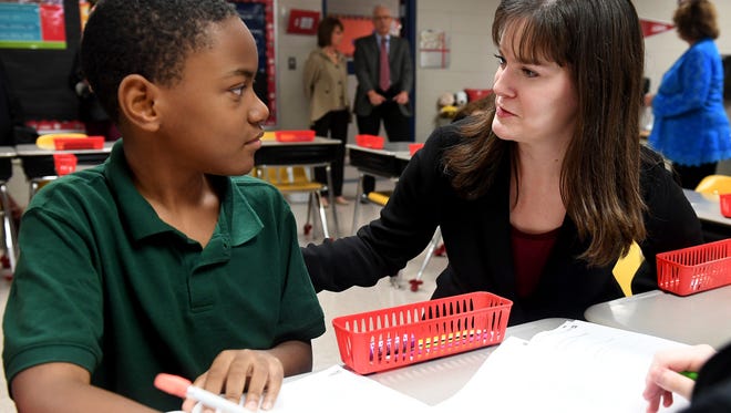 Tennessee Education Commissioner Candice McQueen discusses math problems with East Elementary School 6th grader Jaden Miller during her Classroom Chronicles visit, Wednesday, November 1.