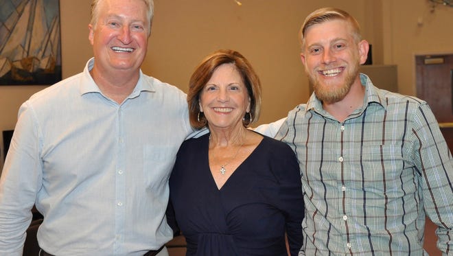 Andy Andrews poses with Karen Dominik and her son, Nathan, following Andrews' presentation to the Bonita Christian Forum Nov. 14. Nathan has said Andrews' book "The Noticer" changed the course of his life.
