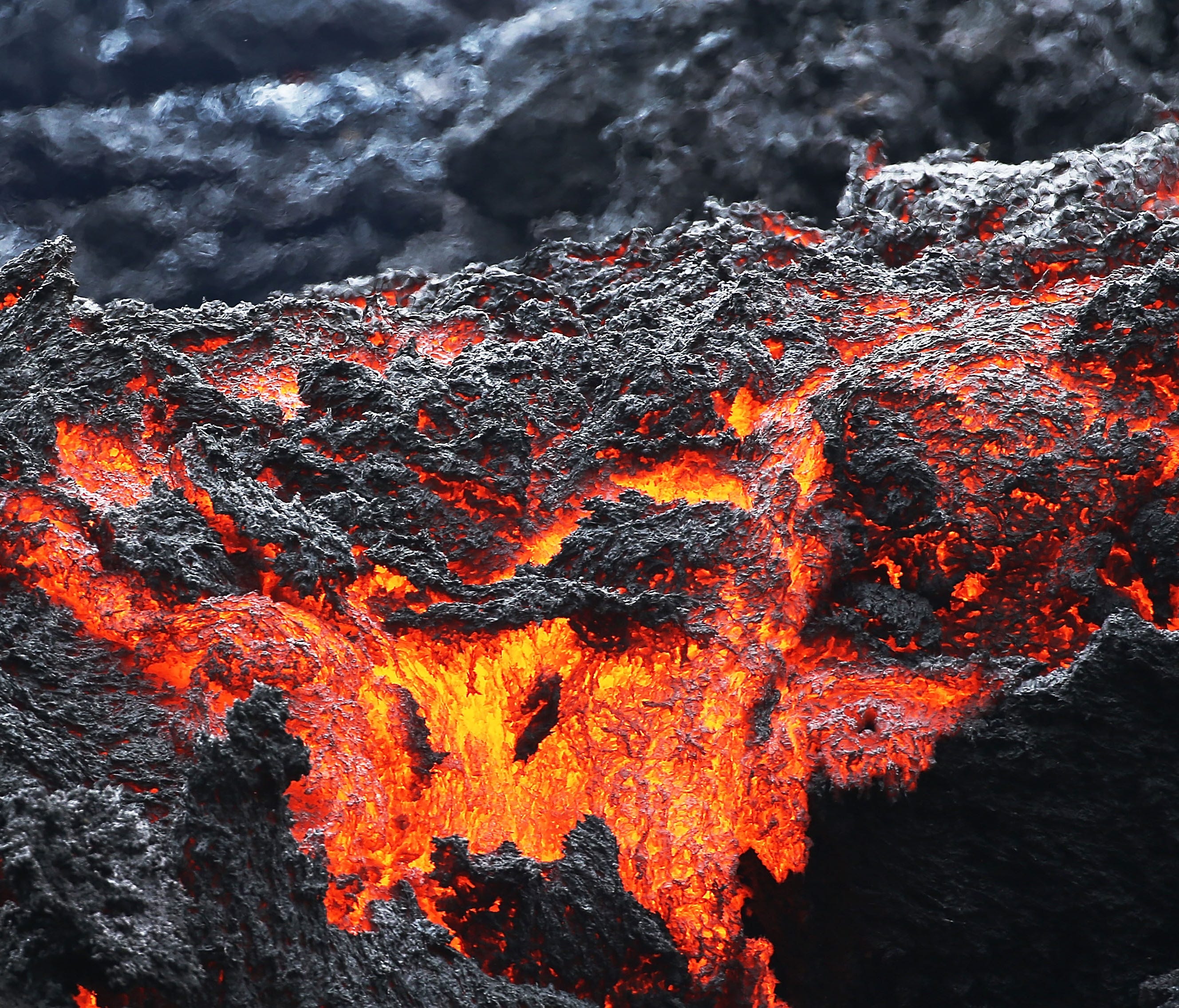 Lava flows at a lava fissure in the aftermath of eruptions from the Kilauea volcano on Hawaii's Big Island on May 12, 2018 in Pahoa, Hawaii.