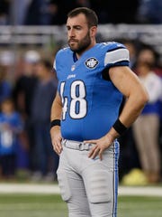 Detroit Lions long snapper Don Muhlbach looks on before