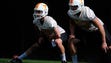 Parker Henry (31) and Trevor Daniel (93) warm up during