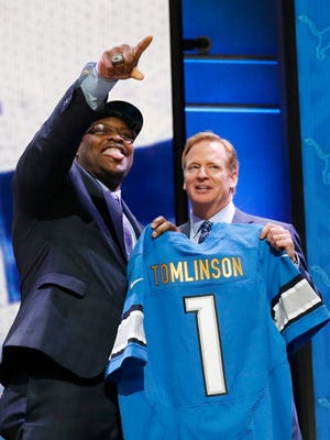 Duke offensive lineman Laken Tomlinson poses for photos with NFL commissioner Roger Goodell after being selected by the Detroit Lions as the 28th pick in the first round of the 2015 NFL Draft,  Thursday, April 30, 2015, in Chicago.